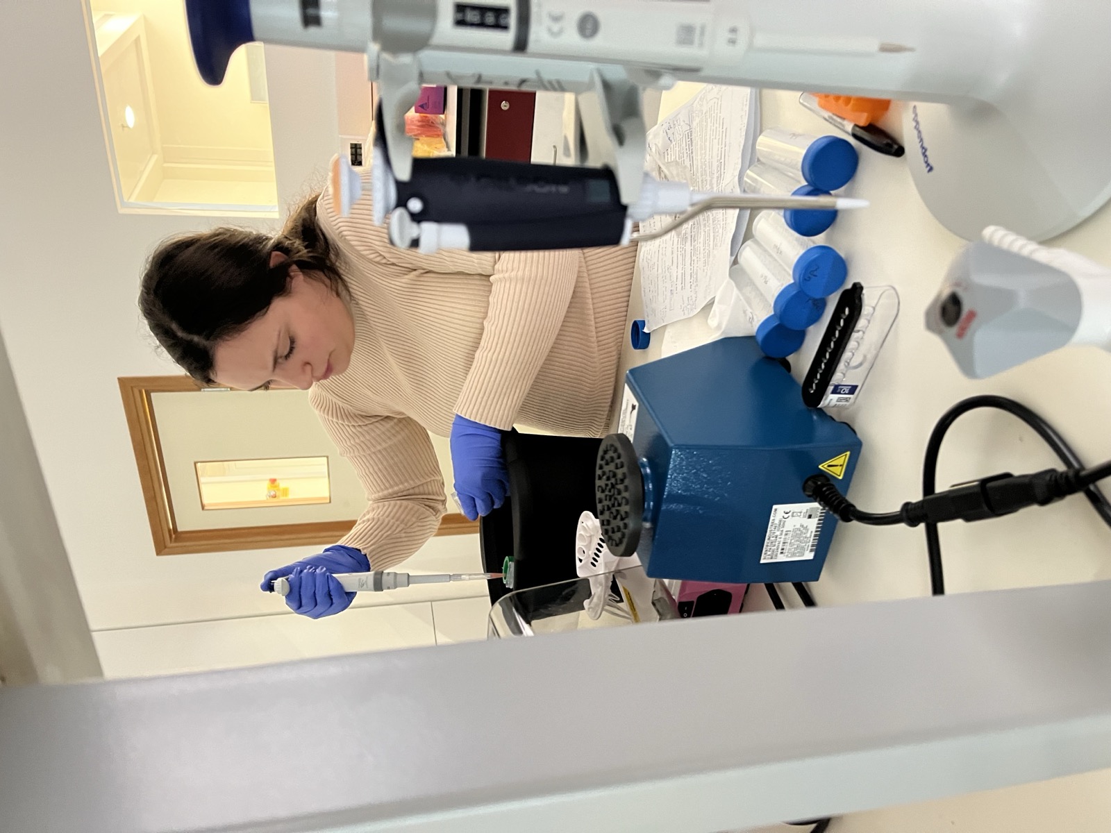 Lab member pipetting in the wet lab